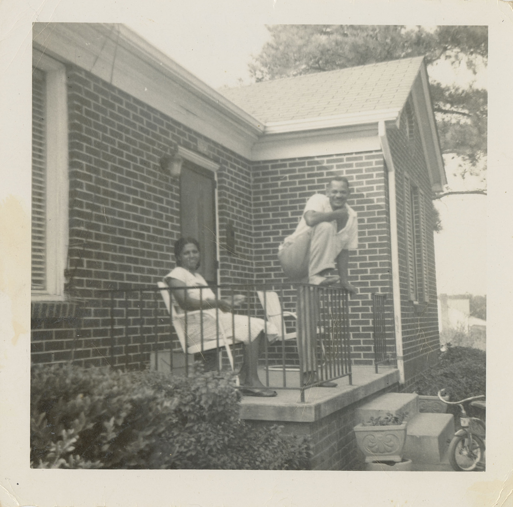 Ethel Bolden and her husband relax on the front porch of their Columbia, South Carolina home